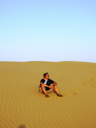 There is simply nothing in the world like sitting on an enormous pile of sand listening to the wind blow sand granules past you while watching the sun set.
