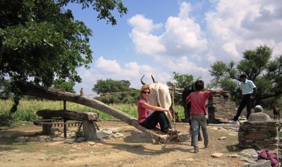 The little kid to the right jumped off and invited Gabi to take a ride on this ancient water wheel, then joined her for a bit.