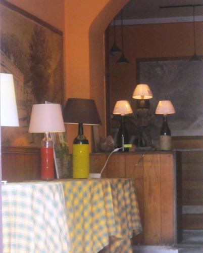 This fabulous display of wine bottle lamps greets diners at Bagni di Lucca's Ristorante da Vinici. Today's purchase is tomorrow's yard sale item.