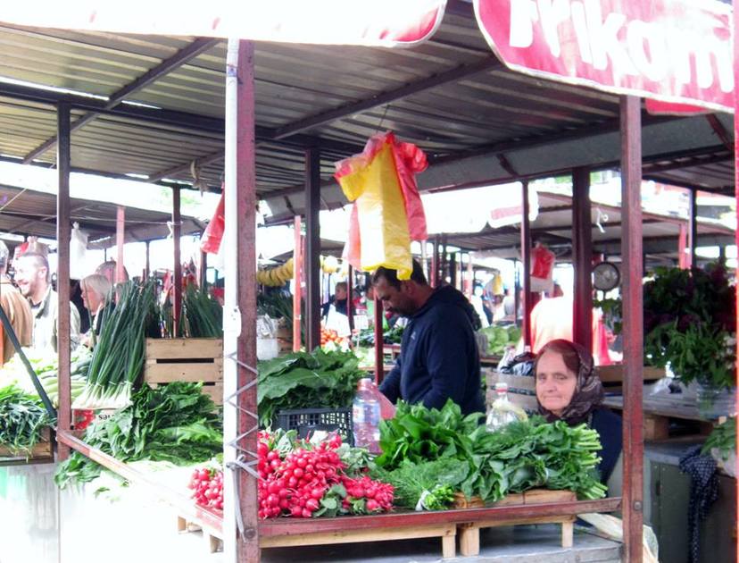 An elderly woman awaits a customer in Belgrade's open air market.
