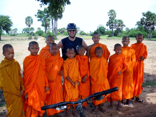 Yours truly with a bunch of young monks during a bike ride outside of Phnom Penh a couple of years ago.