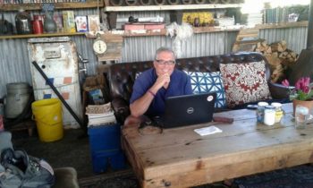 A typical pose for the purveyor of prose, this time in The Blue Shed coffee shop, Mosselbai, South Africa